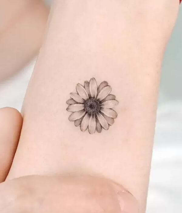 Black and grey daisy bouquet tattoo