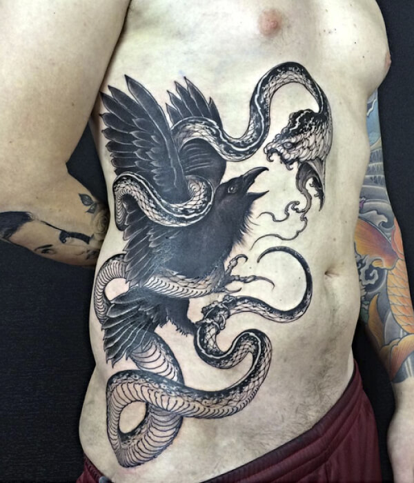 Black raven tattoo with a snake