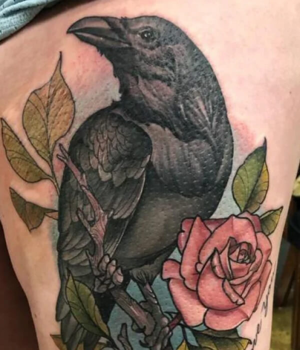 Black raven tattoo with rose