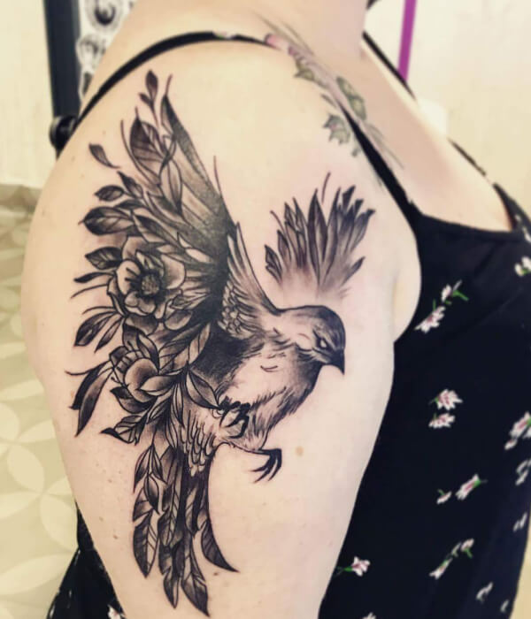 Black raven tattoo with spread-out wings