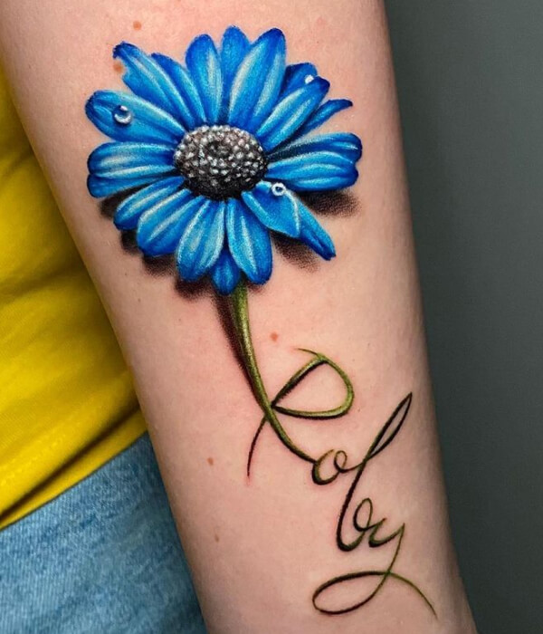 Blue daisy tattoo
