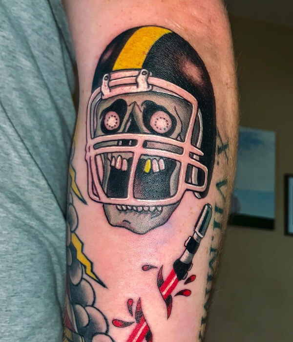 Colorful skull with football helmet tattoo