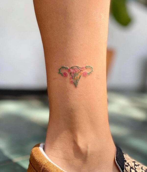 Colorful uterus tattoo