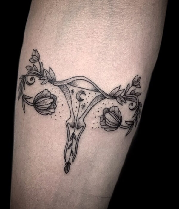 Crescent moon womb tattoo