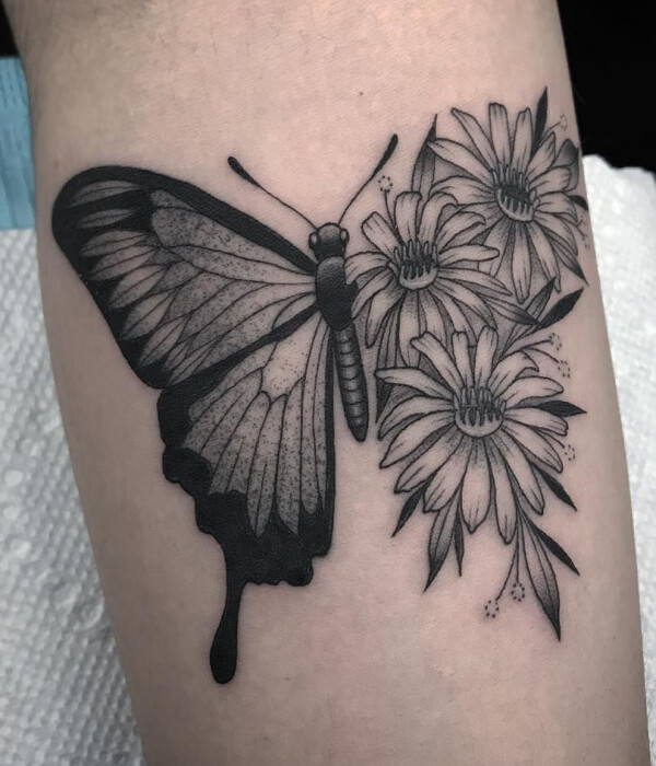 Daisy tattoo with butterfly