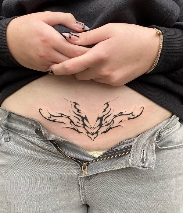 Delicate womb tattoo