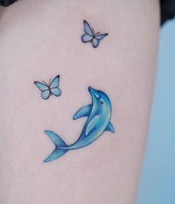 Dolphin tattoo with butterfly