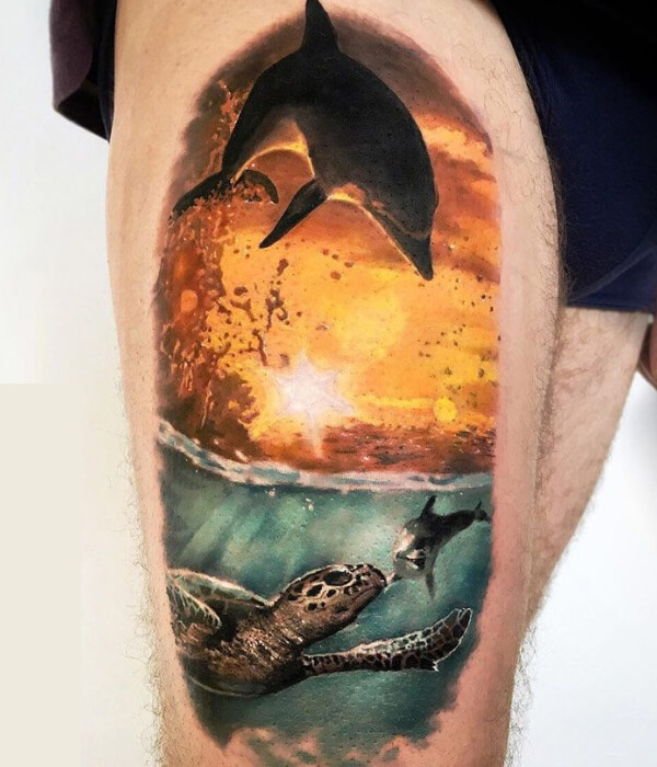 Dolphin tattoo with sunset
