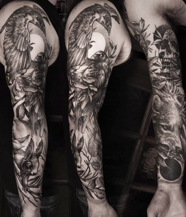 Full-sleeve black raven tattoo