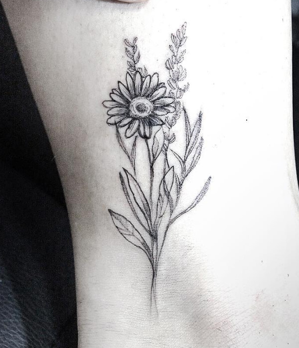 Greyscale daisy tattoo