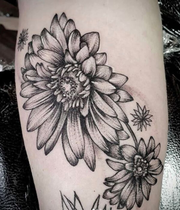 Greyscale daisy tattoo