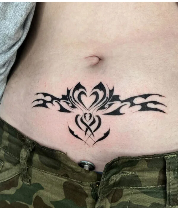 Heart-shaped womb tattoo