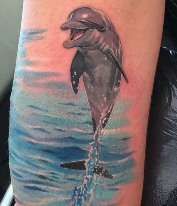 Jumping dolphin tattoo