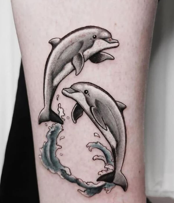 Jumping dolphin tattoo