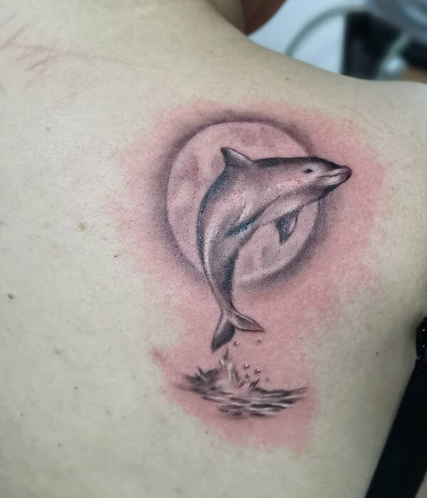 Lunar dolphin tattoo designs