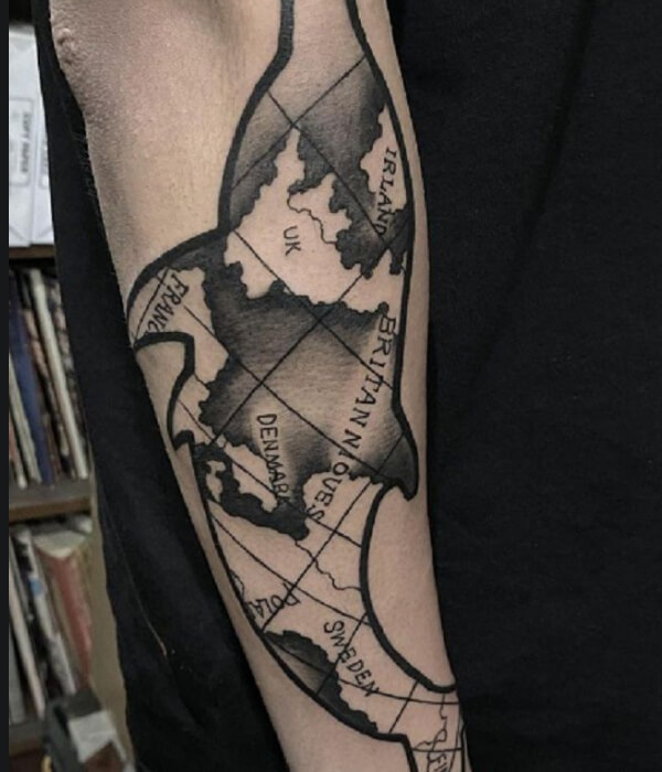 Map-themed dolphin tattoo