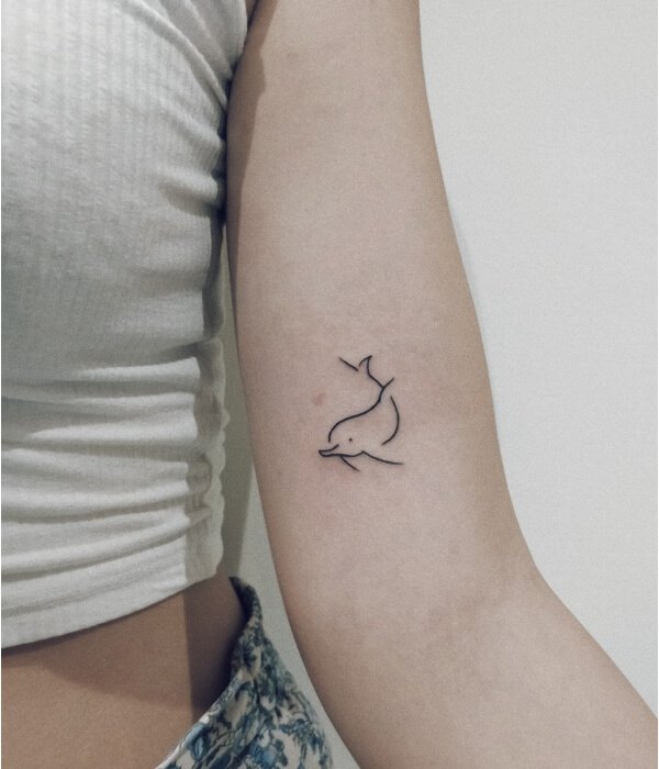 Minimalistic dolphin tattoo designs