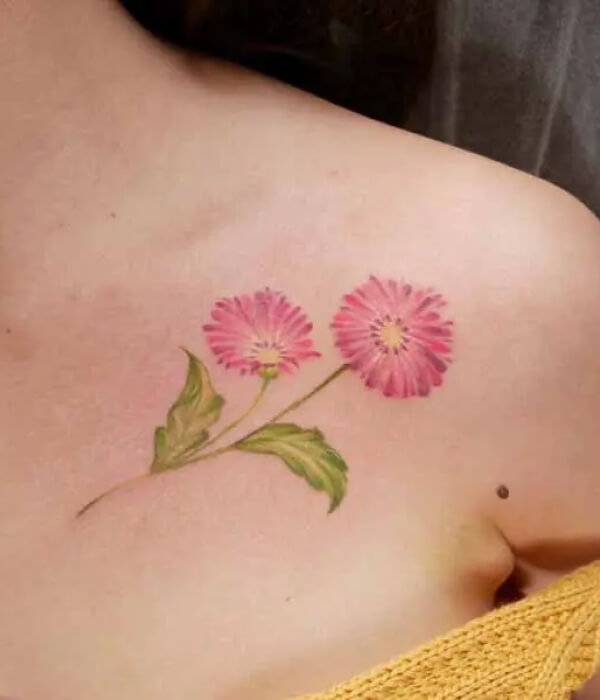 Pink daisy tattoo