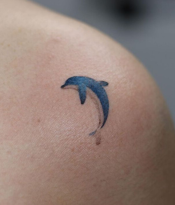 Simple blue dolphin tattoo