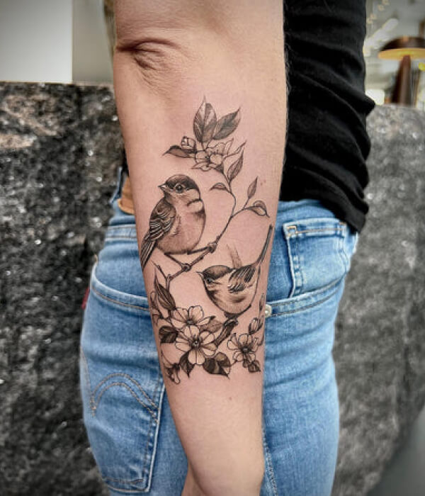 Sparrow tattoo with flowers