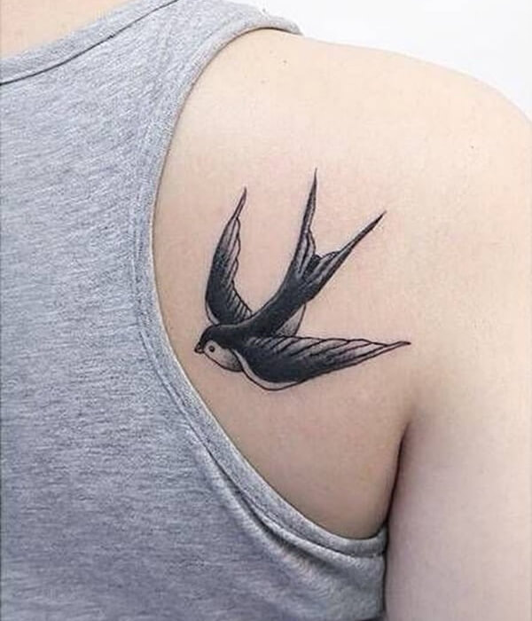 Swallow bird tattoo with fluttering wings