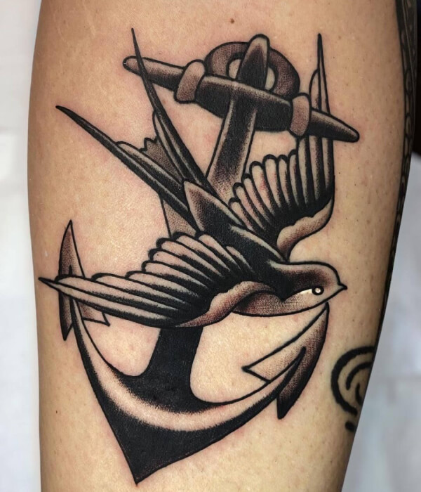 Swallow tattoo with anchor