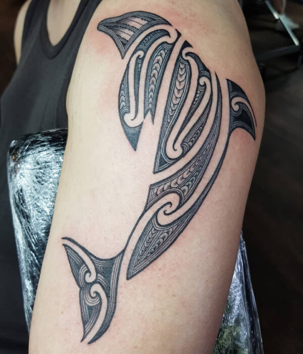 Tribal dolphin tattoo