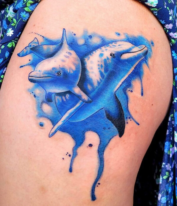 Watercolor dolphin tattoo