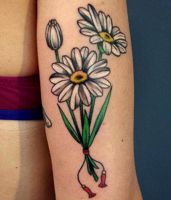White daisy tattoo in a pair