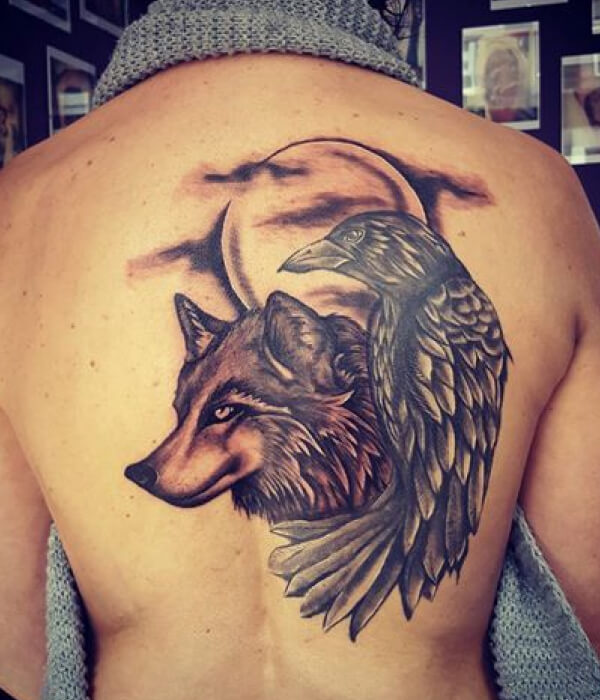 Wolf with raven tattoo
