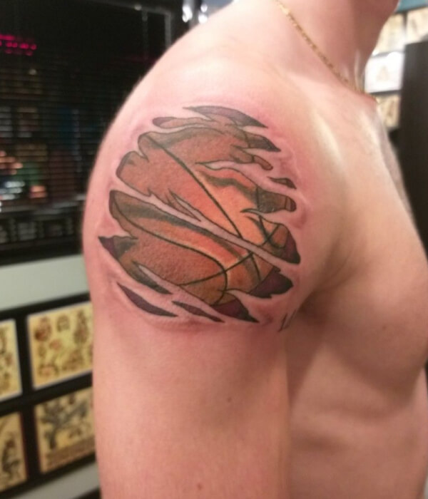 Basketball tattoo design with ripped skin