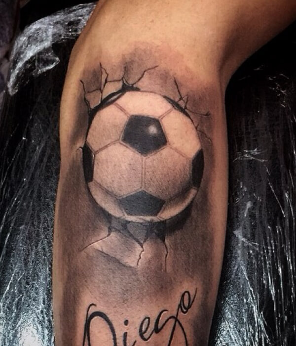 Black and gray soccer ball with name tattoo