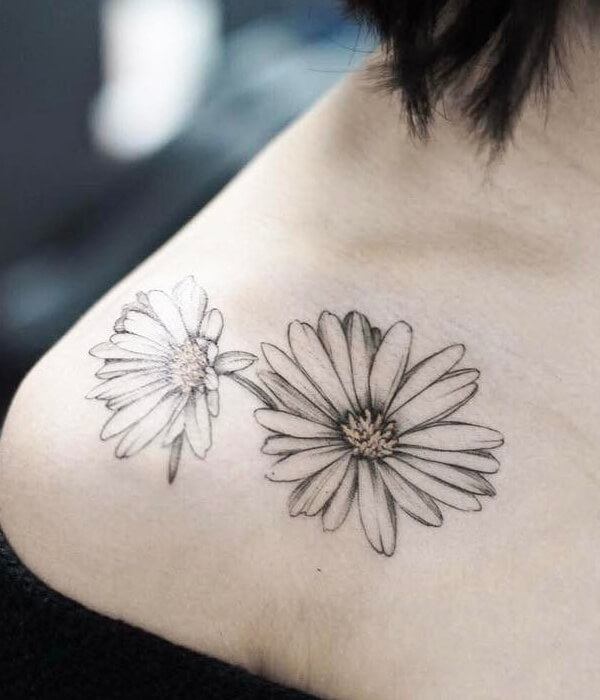 Black and white sunflower on shoulder tattoo