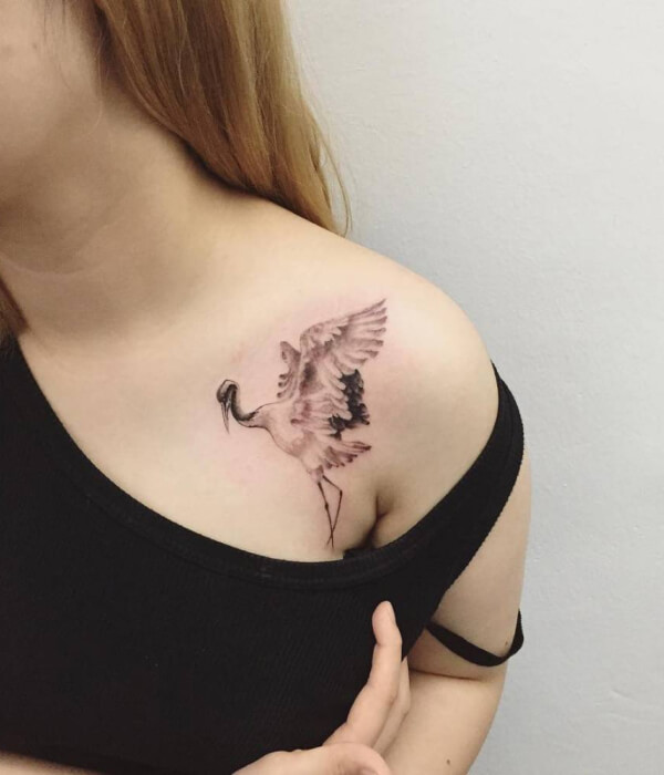 Crane shoulder bird tattoo for women