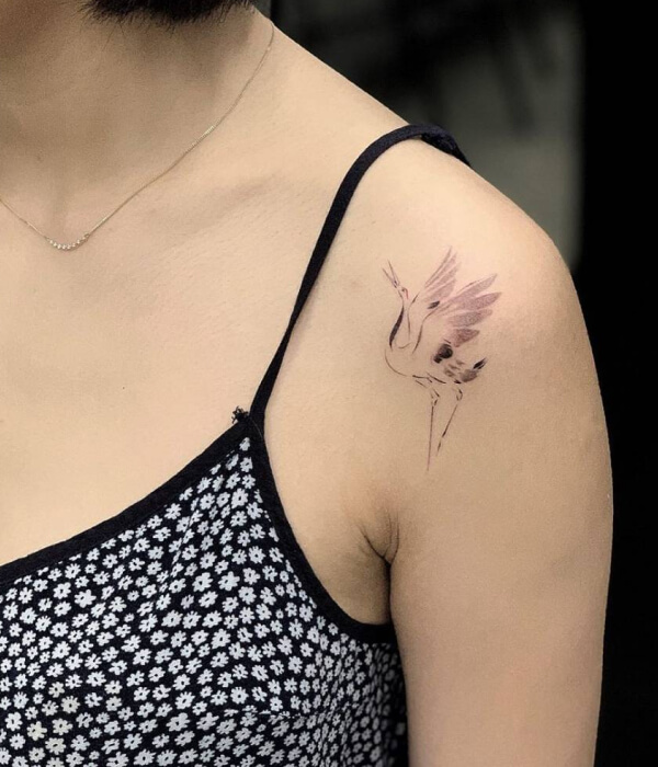 Crane shoulder tattoo for women