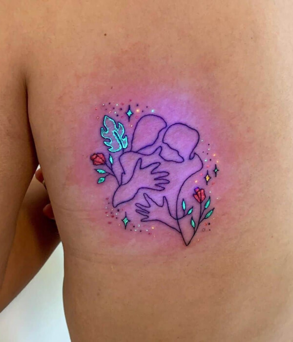 Floral UV on back Tattoo