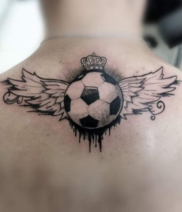 Football back tattoo with wings