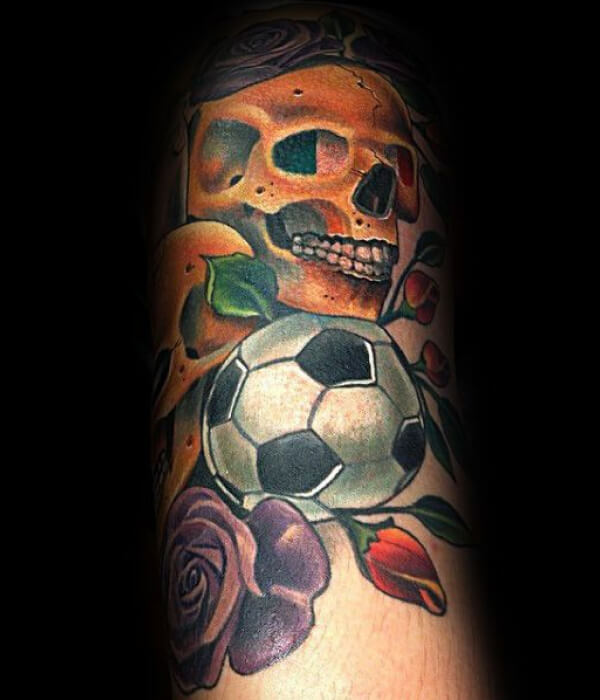 Football tattoo with fowerand a skull
