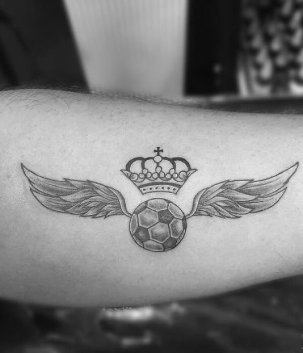 Football tattoo with wings