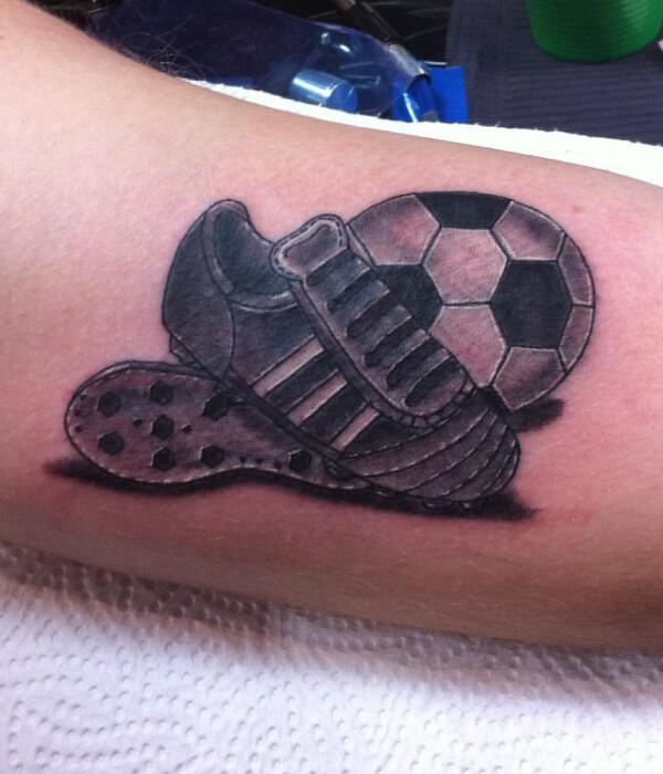 Football with shoe hand tattoo