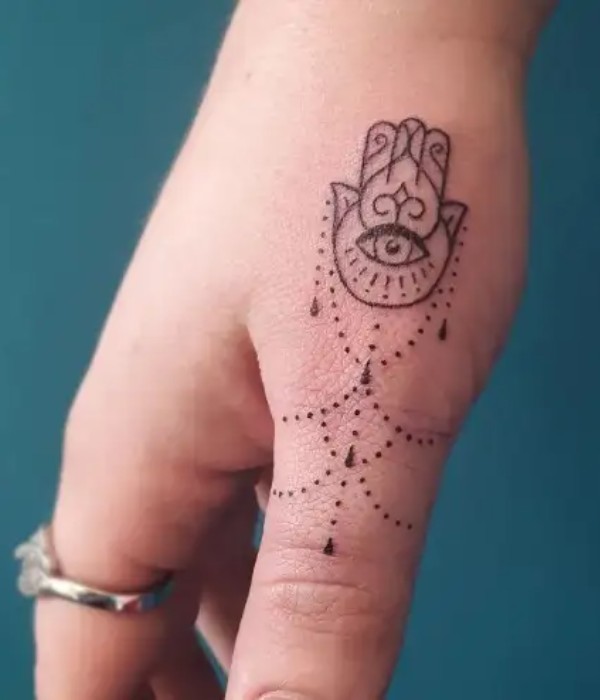 Hamsa Thum Tattoo