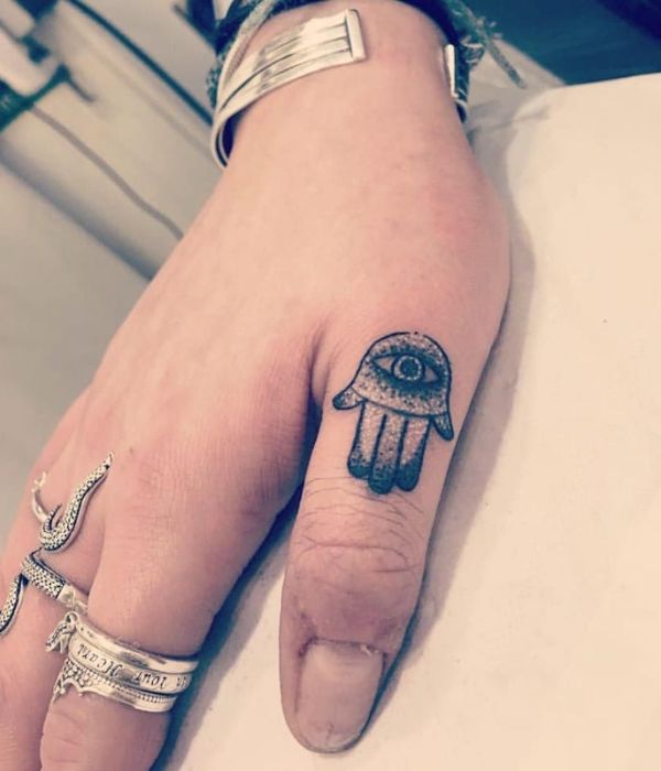 Hamsa Thumb Tattoo