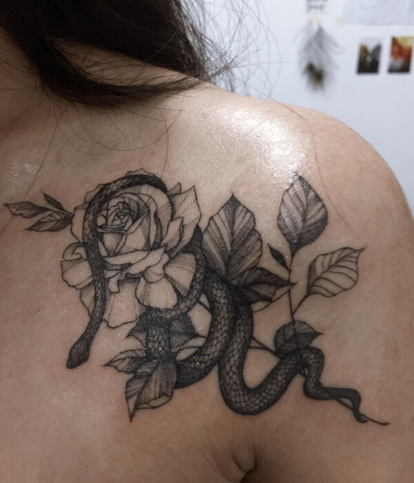 Roses and snake tattoo