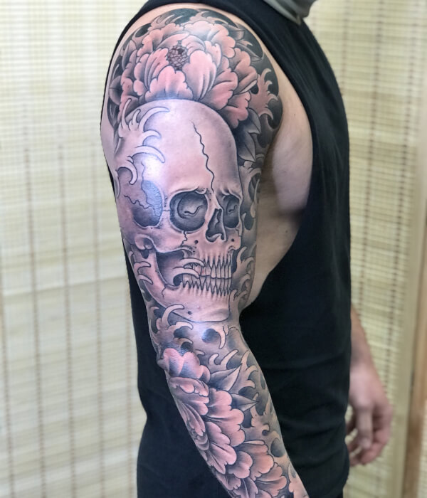 Skull full sleeve tattoo