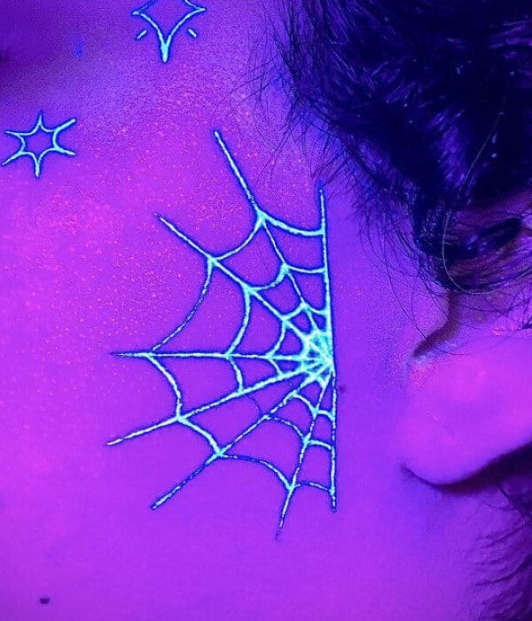 Spider Web UV near ear Tattoo