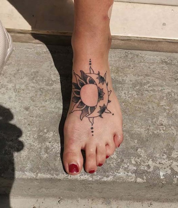 Sun and moon matching foot tattoos