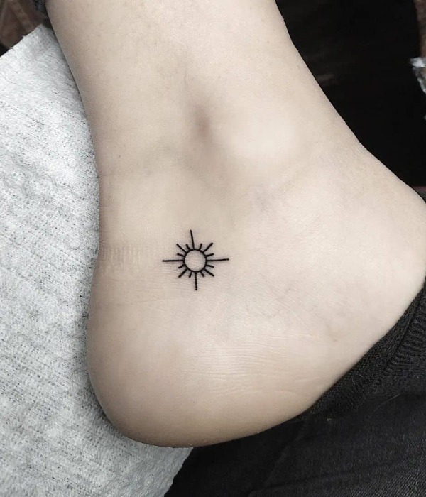 Tiny sun ankle tattoos