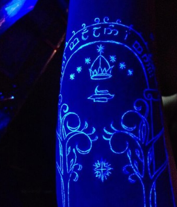 UV Tattoo with crown on hand