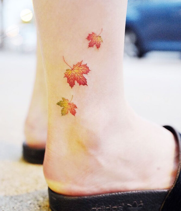 Orange maple leaf tattoo design