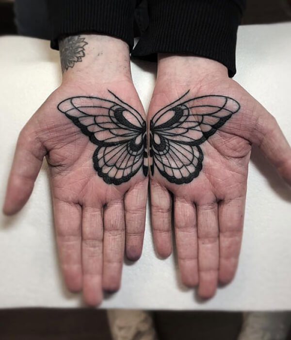Butterfly palm tattoo
